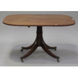 A George III mahogany tip-top breakfast table, the curved rectangular top on a turned column and