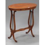 An Edwardian satinwood oval occasional table, raised on twin lyre supports and scroll feet, height