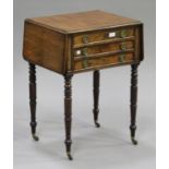 A Regency mahogany drop-flap work table, the top with a moulded edge above two drawers, on turned