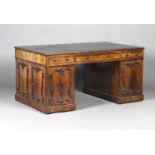 An early Victorian figured mahogany twin pedestal partners desk, the sides and doors with applied