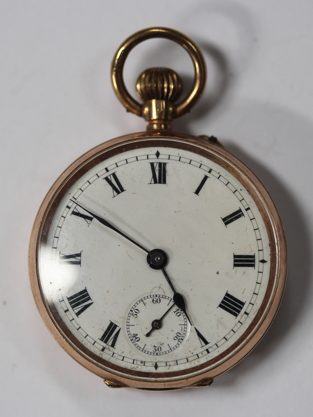 A 9ct gold keyless wind open faced lady's fob watch, the enamelled dial with Roman numerals and