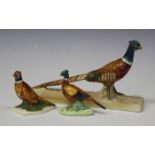 A Beswick model of a pheasant on a rectangular base, No. 1774, length 22cm, another Beswick model of