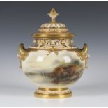 A large Royal Worcester porcelain two handled potpourri vase and cover, circa 1917, the bulbous body