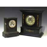 A late 19th century French ebonized mantel clock with eight day movement striking on a gong,