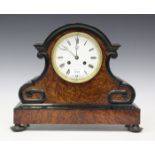 A late 19th century French ebonized and amboyna mantel clock with eight day movement striking on a