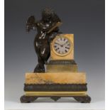An early 19th century French brown patinated bronze, ormolu and Sienna marble mantel clock, the