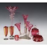 A group of cranberry glassware, late 19th/early 20th century, including a Mary Gregory style
