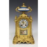 A late 19th century French ormolu and porcelain mantel clock with eight day movement striking on a