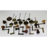 A collection of nine longcase winding keys and eleven various mantel clock pendulums.Buyer’s Premium