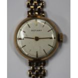 A Rotary 9ct gold circular cased lady's bracelet wristwatch, the signed silvered dial with gilt