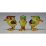 Three Crown Staffordshire pottery condiments, 1930s, each modelled as a winking bird, decorated in