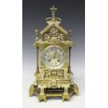 A late 19th century French brass cased mantel clock with eight day movement striking on a bell via