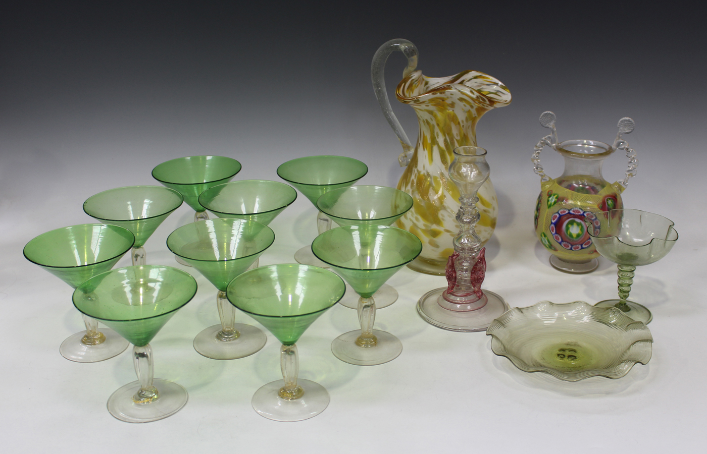 A set of ten Venetian green and clear glass cocktail glasses, each reeded stem and circular foot