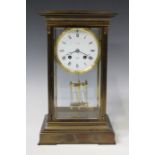 A 20th century French brass cased four glass mantel clock with eight day movement striking on a bell