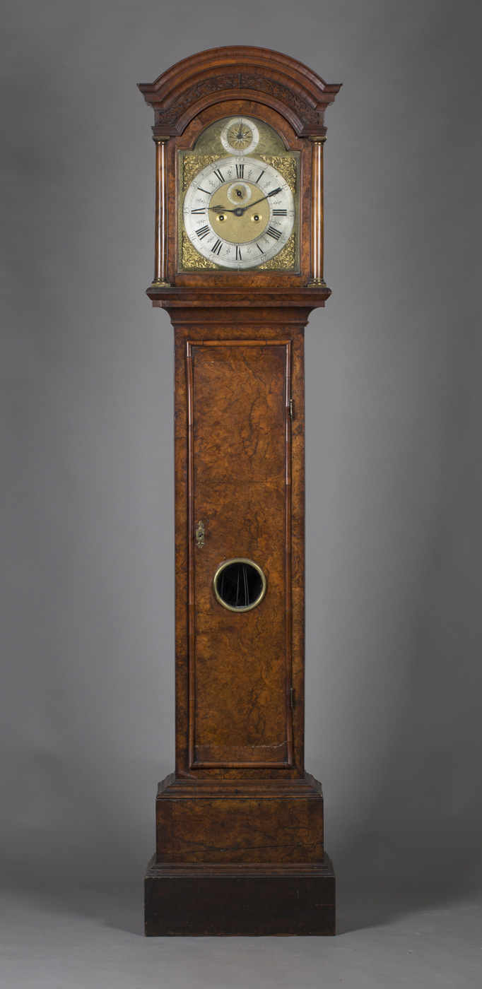 An early 18th century burr walnut longcase clock with brass five-pillar eight day movement