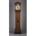 An early 18th century burr walnut longcase clock with brass five-pillar eight day movement