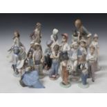 Thirteen Lladro porcelain figures, including Countryman, No. 4664, Cinderella, No. 4828, and