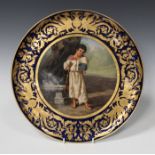 A Vienna style circular porcelain wall charger or plaque, late 19th century, painted with a