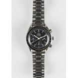 An Omega Speedmaster Automatic steel gentleman's bracelet wristwatch, the signed black dial with