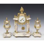 A late 19th/early 20th century French gilt brass and marble mantel clock garniture, the clock with
