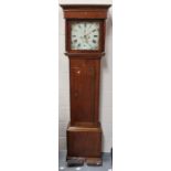 A George III oak longcase clock with eight day movement striking on a bell, the painted dial with