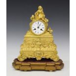 A 19th century French gilt metal mantel clock, the eight day movement with silk suspension and