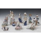Four Lladro porcelain figures, comprising Carnival Couple, No. 4882, Tired Friend, No. 5812,