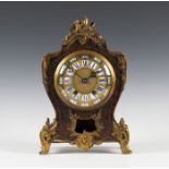 A late 19th century French gilt brass mounted boulle and red tortoiseshell cased mantel clock with