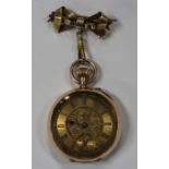 A gold cased keyless wind open-faced lady's fob watch, with an unsigned gilt jewelled movement, base