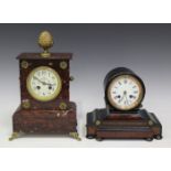 A late 19th century French rouge marble mantel clock with eight day movement striking on a bell, the