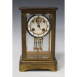 A late 19th century French brass cased four glass mantel clock with eight day movement striking on a