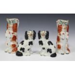 A pair of Staffordshire pottery begging spaniel jugs, circa 1860, each modelled wearing a moulded