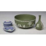 A group of Wedgwood blue and green jasperware, ornamented in white with classical figures and