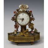 A late 19th century French gilt metal and porcelain mounted boudoir timepiece, the movement with
