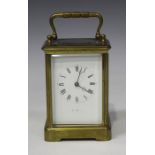 A late 19th century French brass carriage clock with eight day movement striking on a bell, the