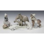 Twelve Lladro porcelain figures, including Maternal Elephant, No. 4765, Platero and Marcelino, No.