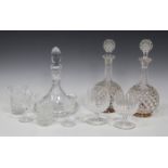 A pair of shaft and globe diamond cut glass decanters and stoppers, late 19th century, together with