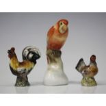 A miniature Meissen porcelain model of a cockerel, circa 1900, blue crossed swords mark to base,