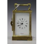 A 20th century brass cased carriage timepiece, the enamel dial inscribed 'Henley, England', height