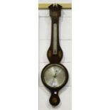 A George III mahogany wheel barometer with alcohol thermometer and silvered dials, inscribed 'A.