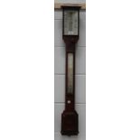 A late Victorian oak stick barometer with mercury thermometer, the dial with twin angled ivory