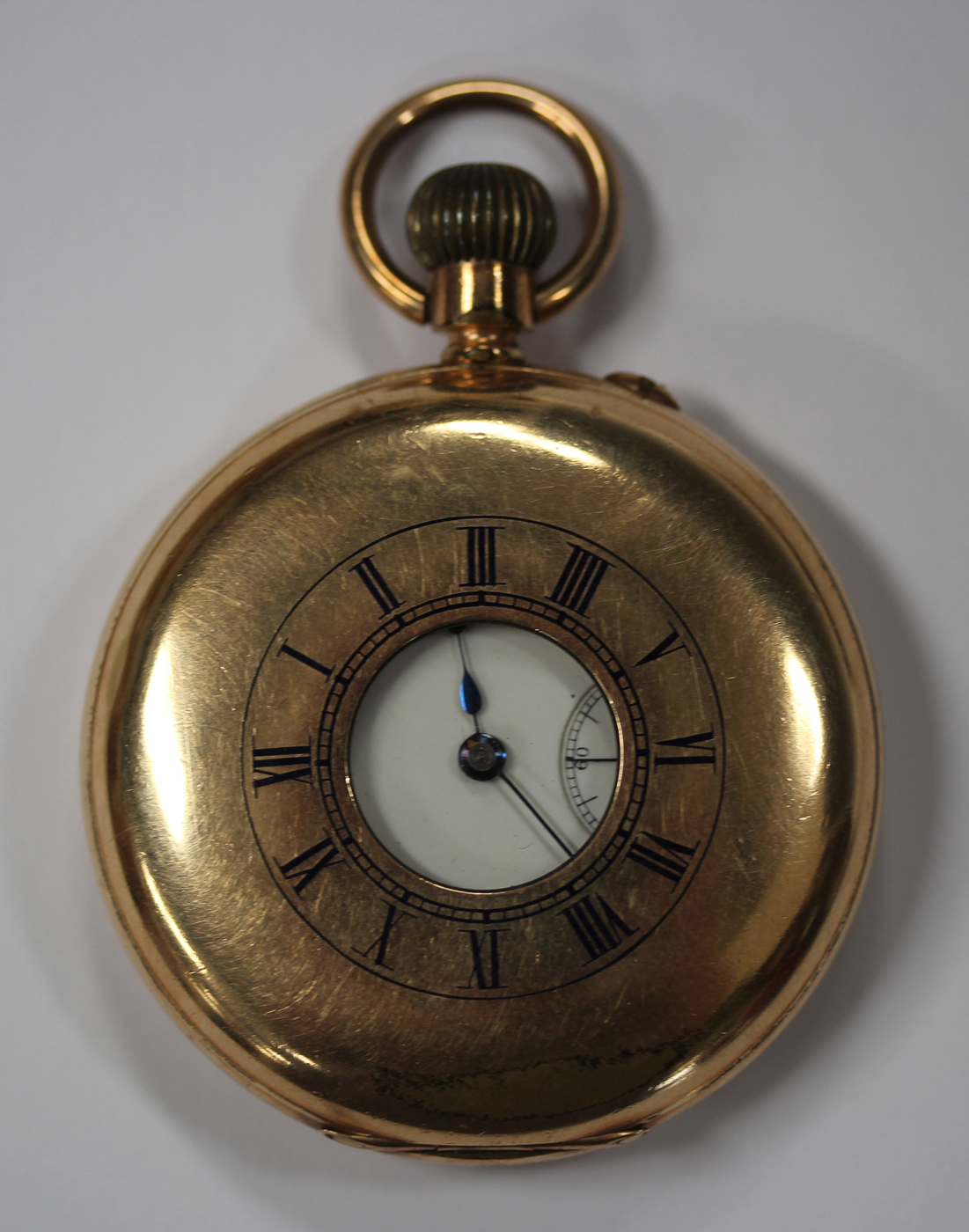 A gilt metal keyless wind half-hunting cased gentleman's pocket watch, the gilt jewelled lever