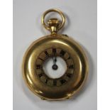 An 18ct gold keyless wind half-hunting cased lady's fob watch, with a gilt jewelled movement, 18ct