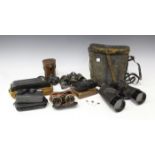 A Leica mini zoom camera, a pair of Bausch & Lomb 7 x 50 US Navy binoculars, two Kodak pocket