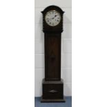 A George V oak diminutive longcase clock with eight day movement striking on a gong, the silvered