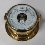 A late 20th century Schatz brass cased precision barometer with thermometer, within a brass ship's
