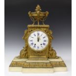 A late 19th century French ormolu and white marble mantel clock with eight day movement striking