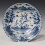 A Spanish maiolica circular dish, probably Puento del Arzobispo, 18th century, painted in blue