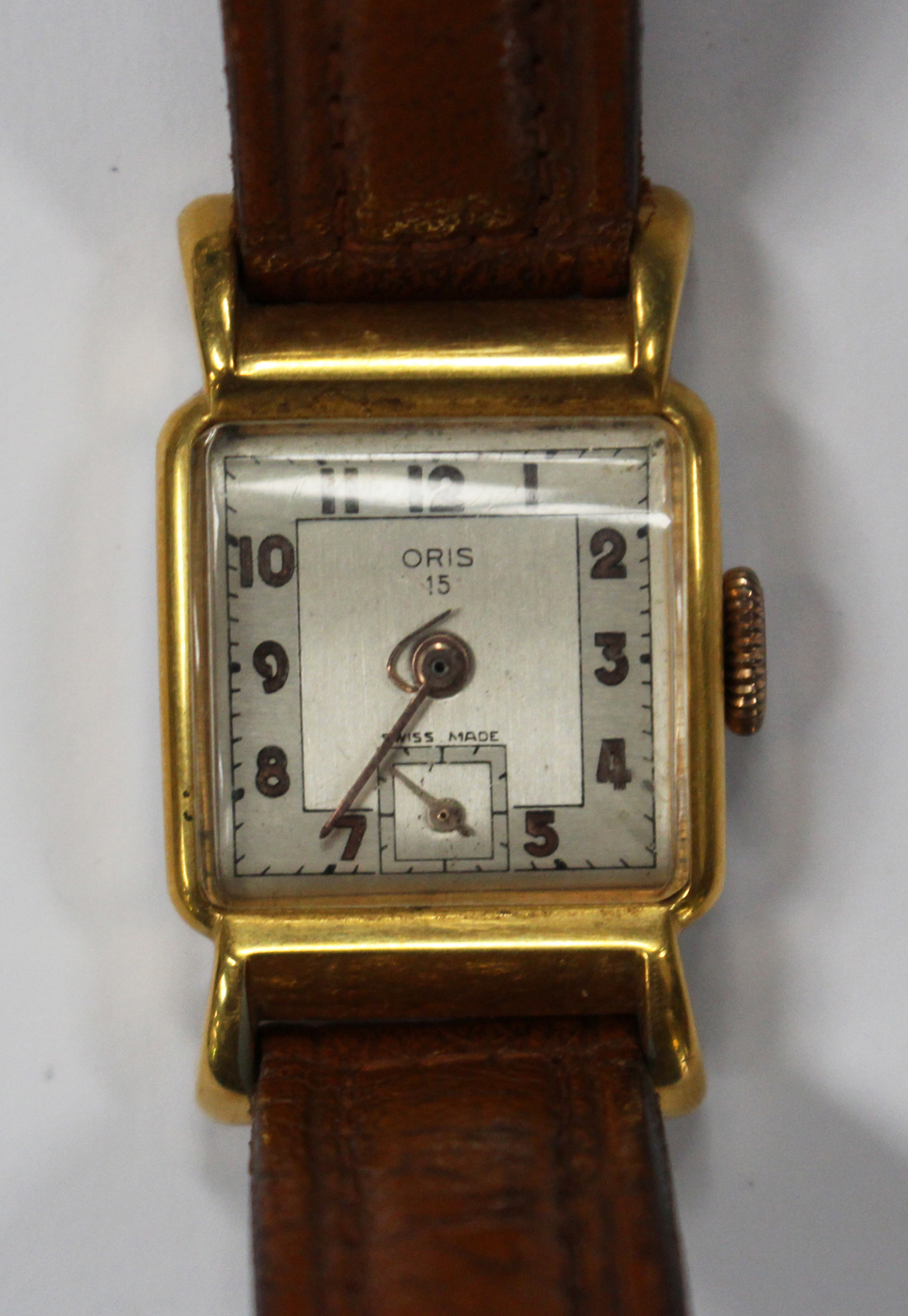 An Oris 15 gilt metal fronted and steel backed wristwatch, the signed square silvered dial with