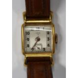 An Oris 15 gilt metal fronted and steel backed wristwatch, the signed square silvered dial with
